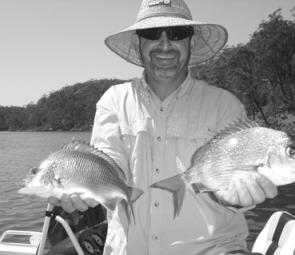 Mick Horne of Merimbula with a 38cm snapper and a 33cm bream from the clear waters of Pambula Lake. Both fish fell to plastics and were released.